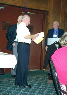 Mayville Potter Reunion - 2005 1957
Jack Higham, 1957, receives a gift of appreciation.
Jim Panton, `53 and Paul Ward, `53 look on.

