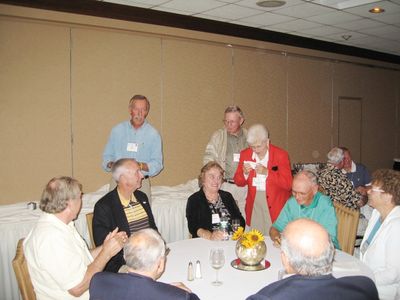 Hank Greets Potter at Reception
Foreground clockwise: John Centra; David Brown; Sven Sloth Peter McManus; Hank Maus; Nancy Centra; Art Weigand; Pam Weigand; Hal Smith; and Barbara Smith
